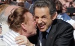 1.	French President and candidate for re-election Nicolas Sarkozy is greeted by a local resident as he visits the medieval town of Guerande, western France