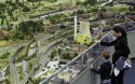 1.	Aron, 5, and his mother look out at the LOXX miniature train landscape at the Alexa shopping centre in Berlin. The huge model train set recreates, in 1:87 scale, Berlin landmarks as well as humorous scenes of everyday life.