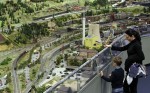 1.	Aron, 5, and his mother look out at the LOXX miniature train landscape at the Alexa shopping centre in Berlin. The huge model train set recreates, in 1:87 scale, Berlin landmarks as well as humorous scenes of everyday life.